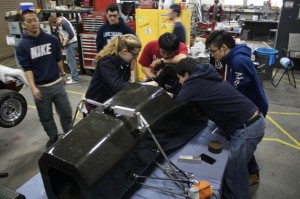 Cornell Racing FSAE team members work on the carbon fiber monocoque.