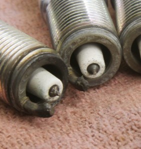 This is a close-up of a couple of spark plugs that indicated trouble in the cylinder. You can clearly see those black specs on the center electrodes, but perhaps what is more troubling is the fact that the ground electrodes are melted. The fix for this engine was less timing (which reduces heat in the chamber), a non-projected nose spark plug, and a higher octane fuel. 