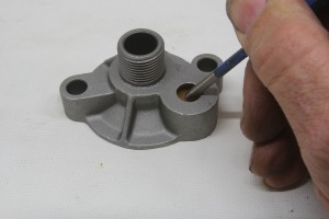 This is the oil filter adapter for a small- or big-block Chevy. It only takes slight pressure to open the valve which allows oil to bypass the filter and go directly to the engine.