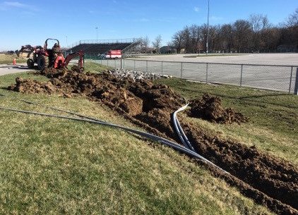 Buried electrical conduit for outdoor racetrack lighting