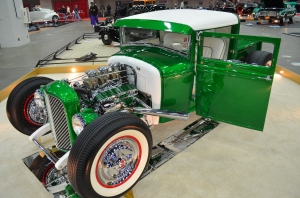 green ford hot rod coupe at indoor car show