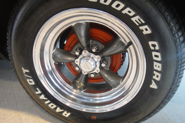 custom wheel and painted brake drum on a classic car