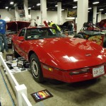 red c4 corvette at indoor car show