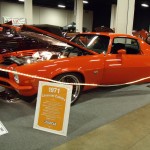 orange 1971 chevy camaro ss at indoor car show