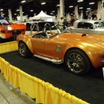 orange shelby cobra coupe at indoor car show