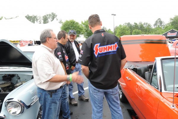 greg anderson & jason line talking with fans at a car show