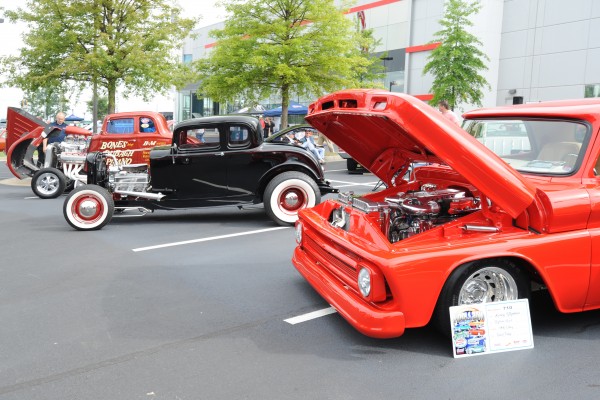 row of classic cars at a show
