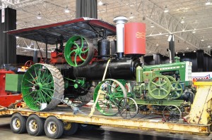 antique green farm tractor display at car show