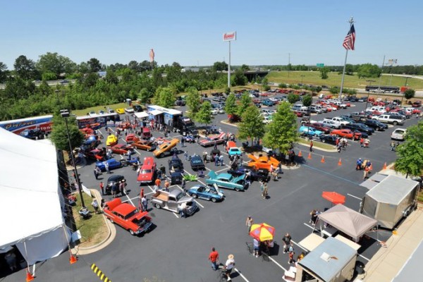 rooftop view of classic cars at a large event