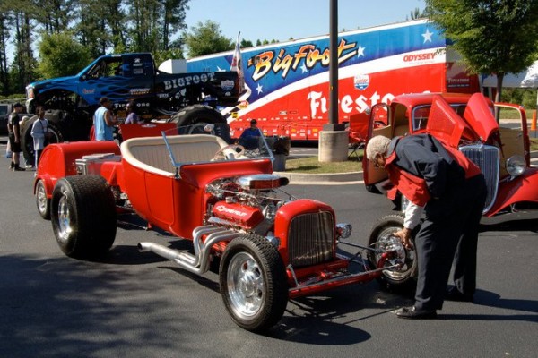 men looking at a t bucket ford hot rod