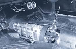 transmission in car from above with floor removed