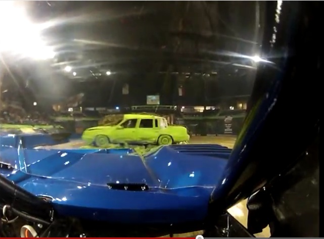 view from driver's seat of bigfoot monster truck during car crush