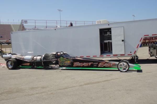 jet dragster next to a trailer