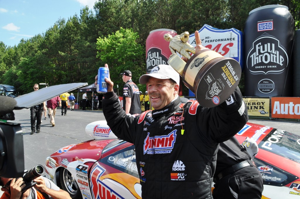 greg anderson lifting wally trophy