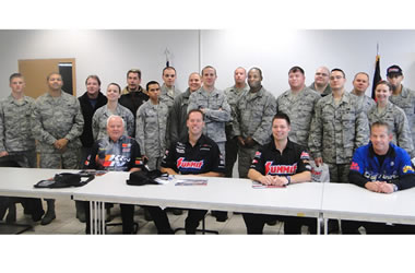 NHRA Drivers taking photos with military troops stationed overseas