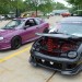 a pair of dodge neon sport compacts at car show thumbnail