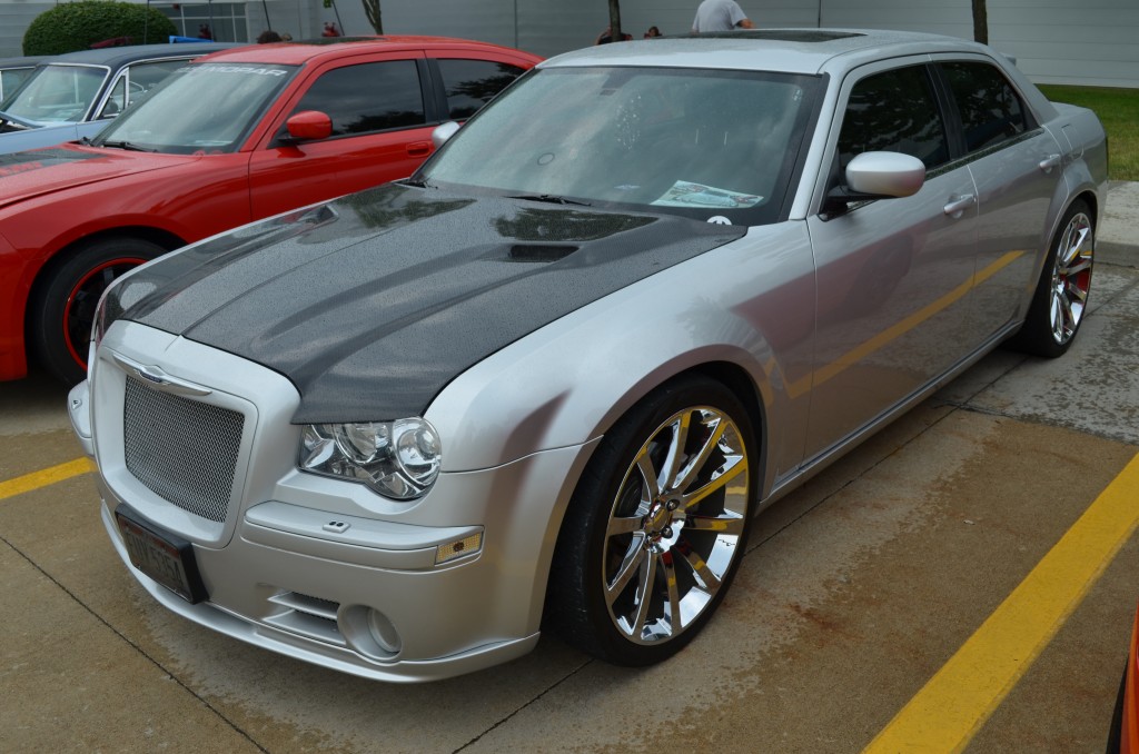 late model chrysler 300 sedan with custom hood