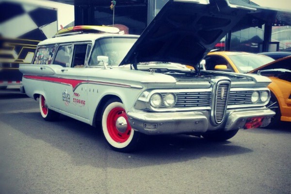 hot rod ford edsel wagon in a car show