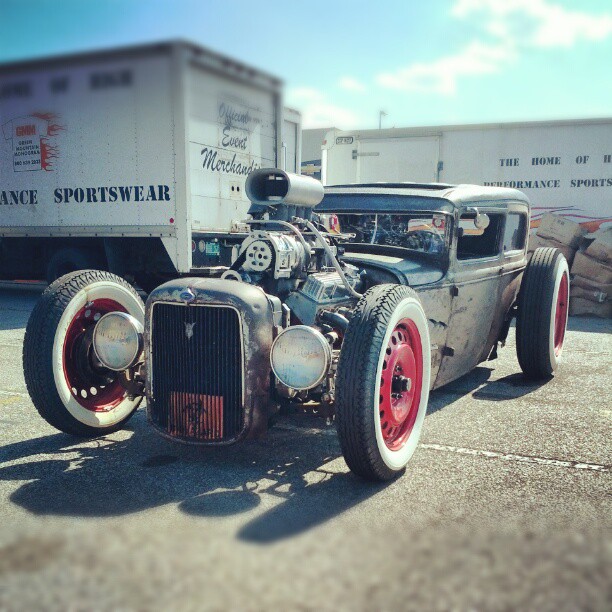 supercharged blown rat rod in parking lot