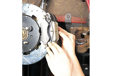 installing brake pads into a caliper