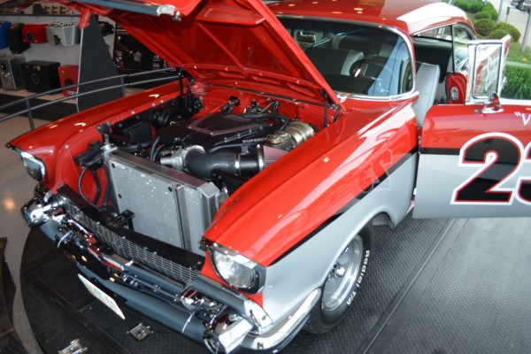 1957 chevy hot rod in edelbrock liver, front with hood up
