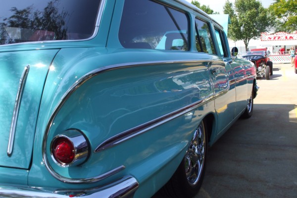 rear view along flanks of a custom 1958 chevy wagon