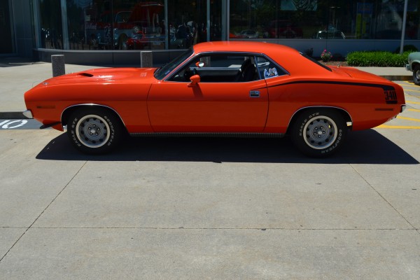 side shot of a red plymouth barracuda 340