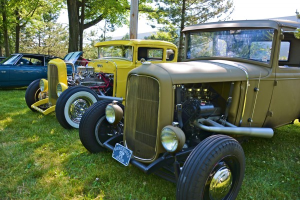 a pair of ford hot rod coupes