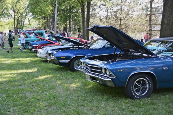 row of vintage cars at a classic vehicle show