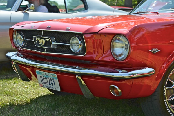close up of a first gen mustang grille and front end