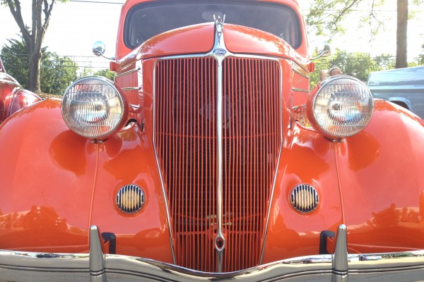 grille of a custom orange ford prewar business coupe