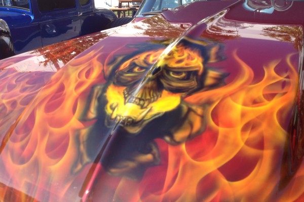 flamed skull paint job on car hood