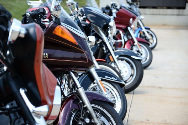 row of motorcycles in a parking lot