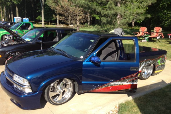 lowered chevy sport truck slammed on the ground at car show