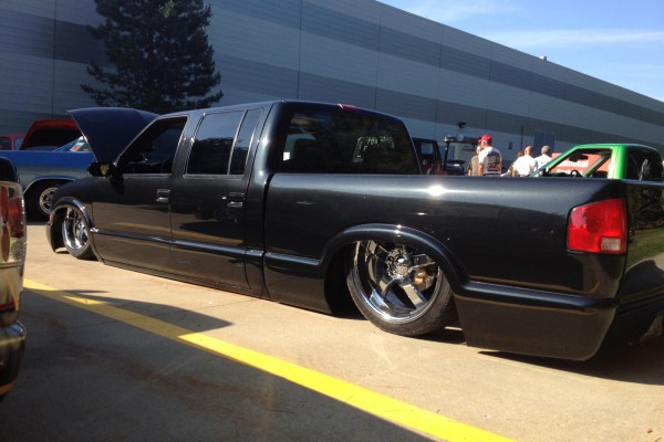 lowered sport truck on airbags at car show