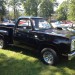 black dodge 150 pickup truck at car show thumbnail