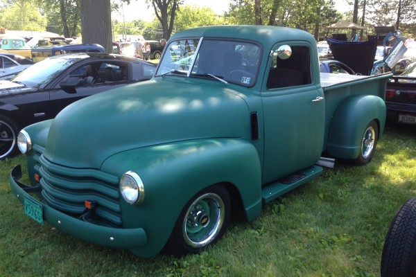 vintage chevy truck with all green paint job