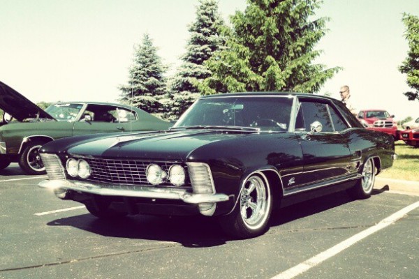 buick riviera in a parking lot