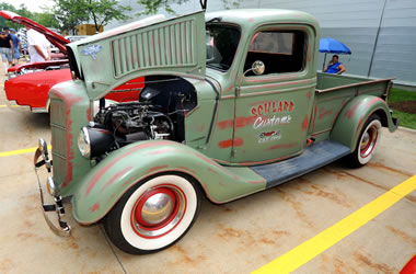 antique truck on display at a car show