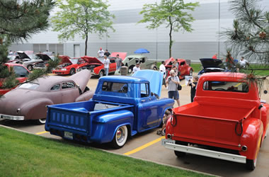 old cars and trucks at a car show