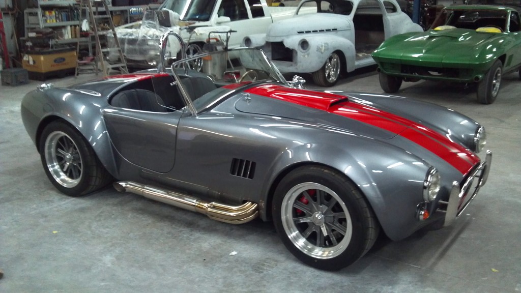 factory five cobra kit car in garage