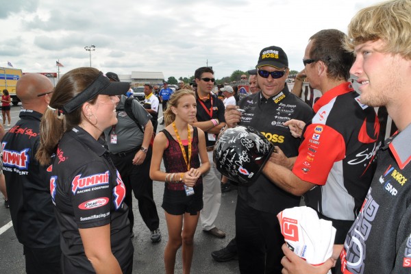 nhra racers signing autographs between races