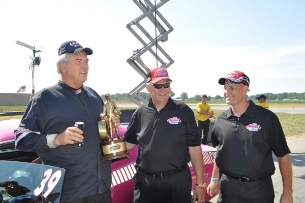 drag racer with a nhra wally trophy