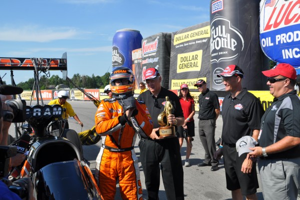 Top Fuel driver grabbing wally at 2012 NHRA Summit Racing NHRA Nationals