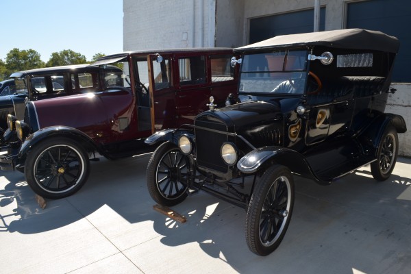 antique cars displayed outside during show