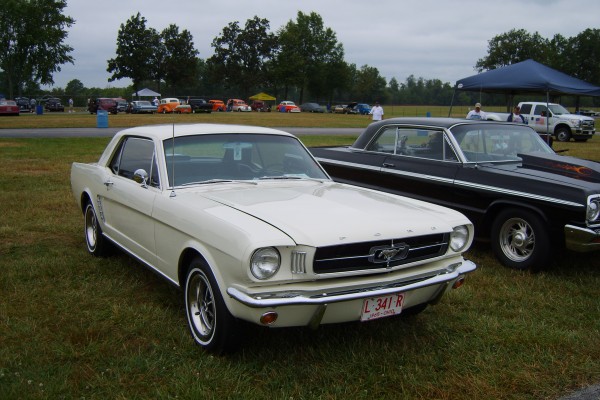 white 1965 ford mustang notchback coupe