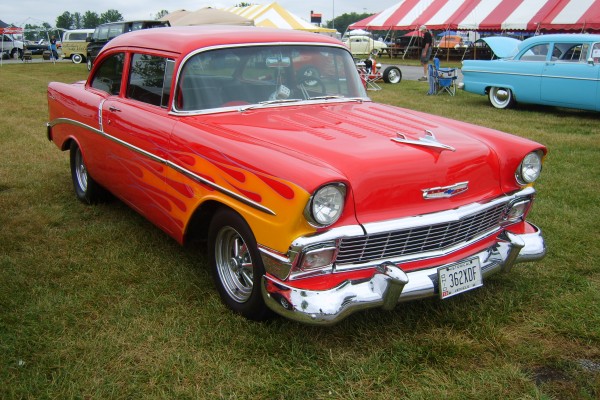 flamed 1956 chevy hot rod coupe with louvered hood