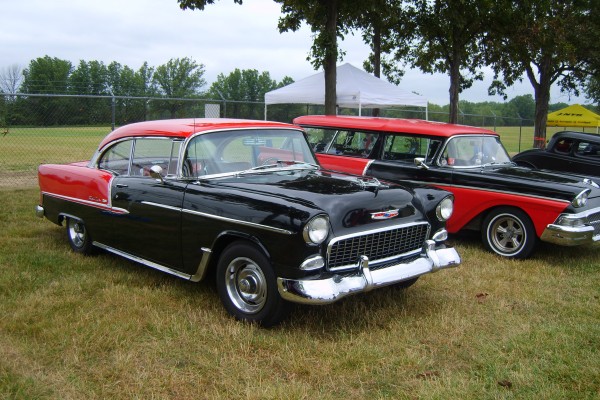 red and black 1955 chevy custom at car show