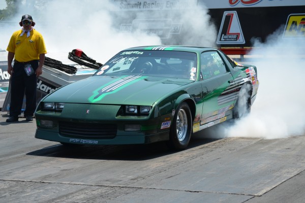 3rd gen chevy camaro doing a burnout prior to a drag race