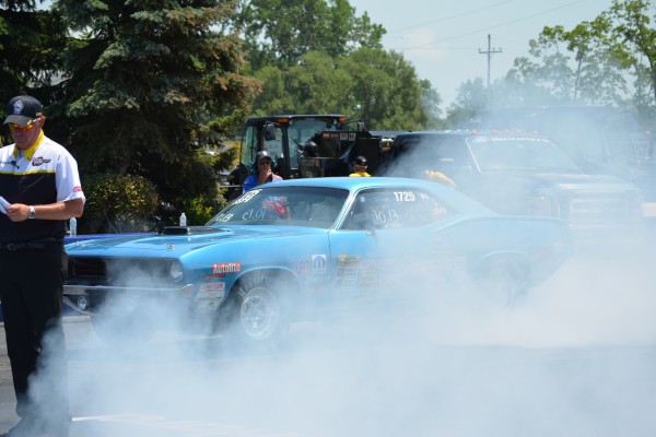 plymouth barracuda drag car doing a burnout prior to a race